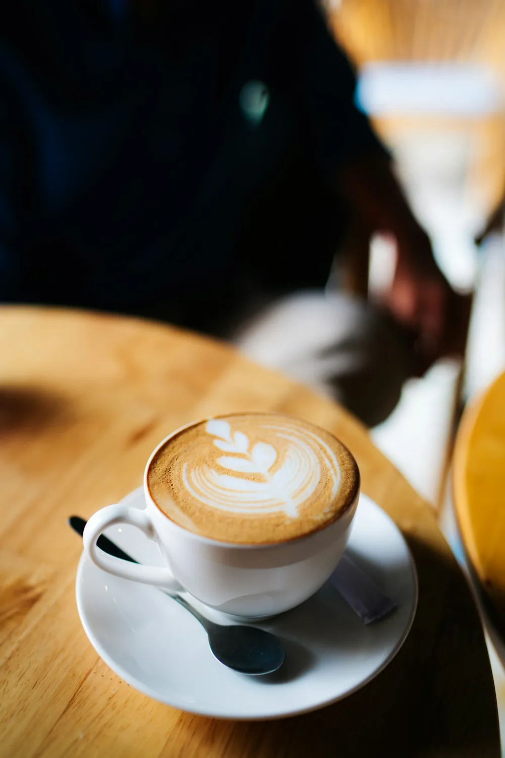 Warm latte on a wooden table